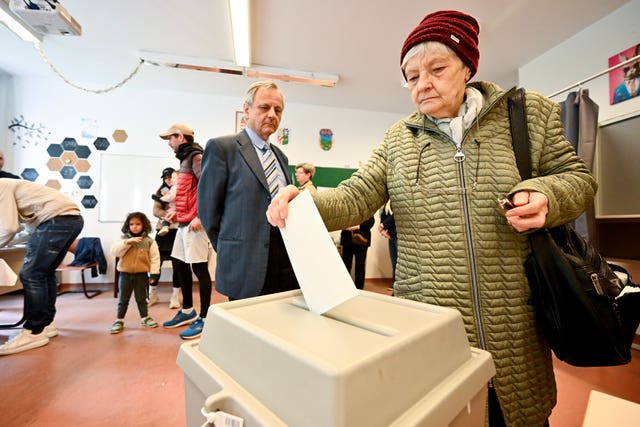 A woman casts her ballot at a polling station during the Hungarian parliamentary election in Budapest