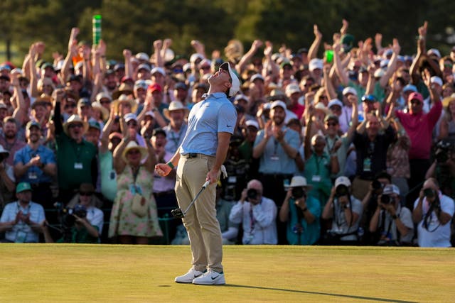 Rory McIlroy, of Northern Ireland, celebrates after winning the Masters