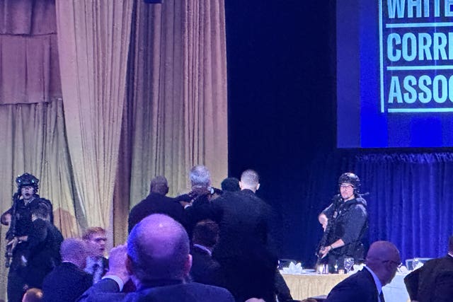 Donald Trump being taken from the dinner by US secret service agents
