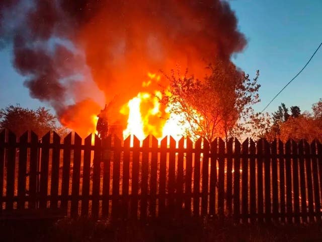 This photo released by Moscow Region Governor Andrei Vorobyev’s official telegram channel shows a house on fire 