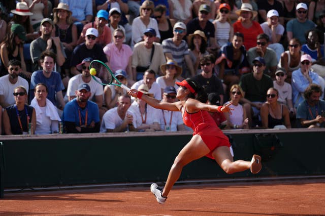 Emma Raducanu lunges for a forehand