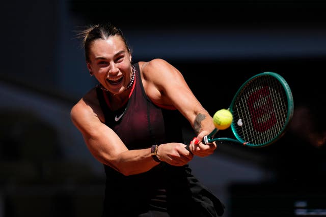 Aryna Sabalenka hits a backhand