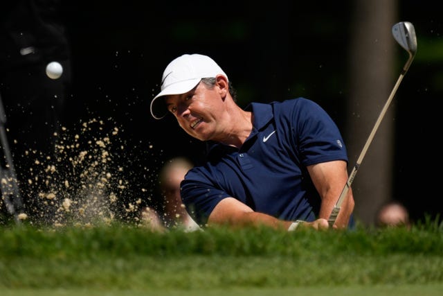 Rory McIlroy hits out of a bunker during the first round of the Memorial golf tournament in Dublin, Ohio 