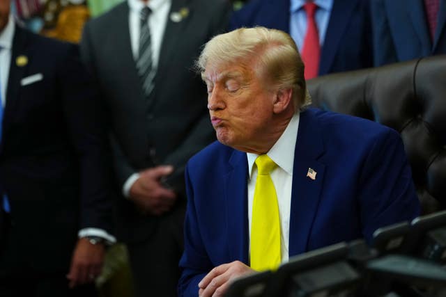 President Donald Trump listens at an event about coal (Julia Demaree Nikhinson/AP)