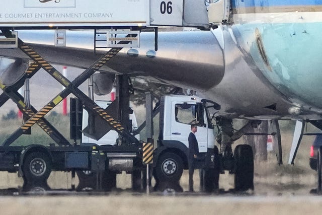 Catering trucks are parked at Air Force One 