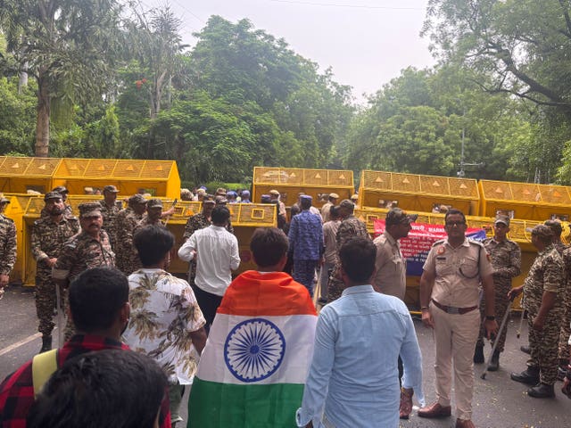 Supporters of the Cockroach Janta Party arrive as they gather to march to India’s Parliament,