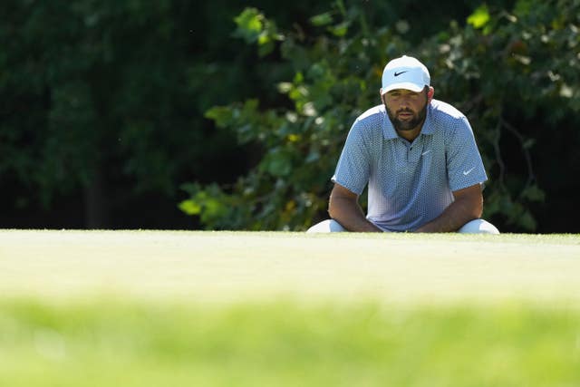 Scottie Scheffler prepares to putt on the green during the first round of the 2026 BMW Championship in St. Louis