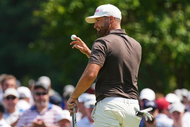 Wyndham Clark waves with his ball after making a putt during the third round of the 2026 BMW Championship in St. Louis