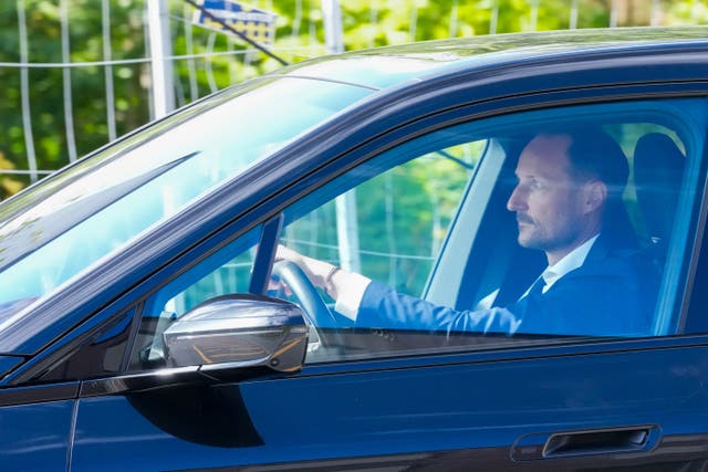 Norwegian Crown Prince Haakon drives a car 