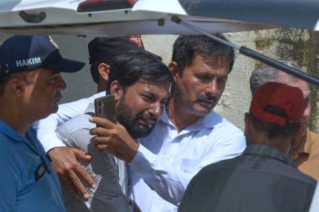 A man is comforted