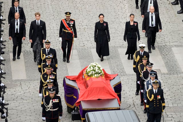 Norway’s Prince Sverre Magnus, King Haakon VIII, Crown Princess Ingrid Alexandra and Princess Martha Louise walk behind the coffin of King Harald V