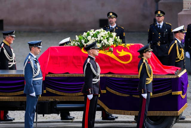 The coffin carrying King Harald V arrives for his funeral ceremony at Oslo Cathedral