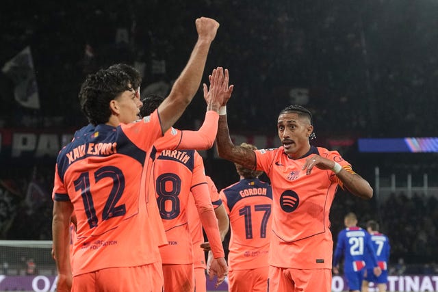 Barcelona’s Xavi Espart, left, celebrates his equaliser